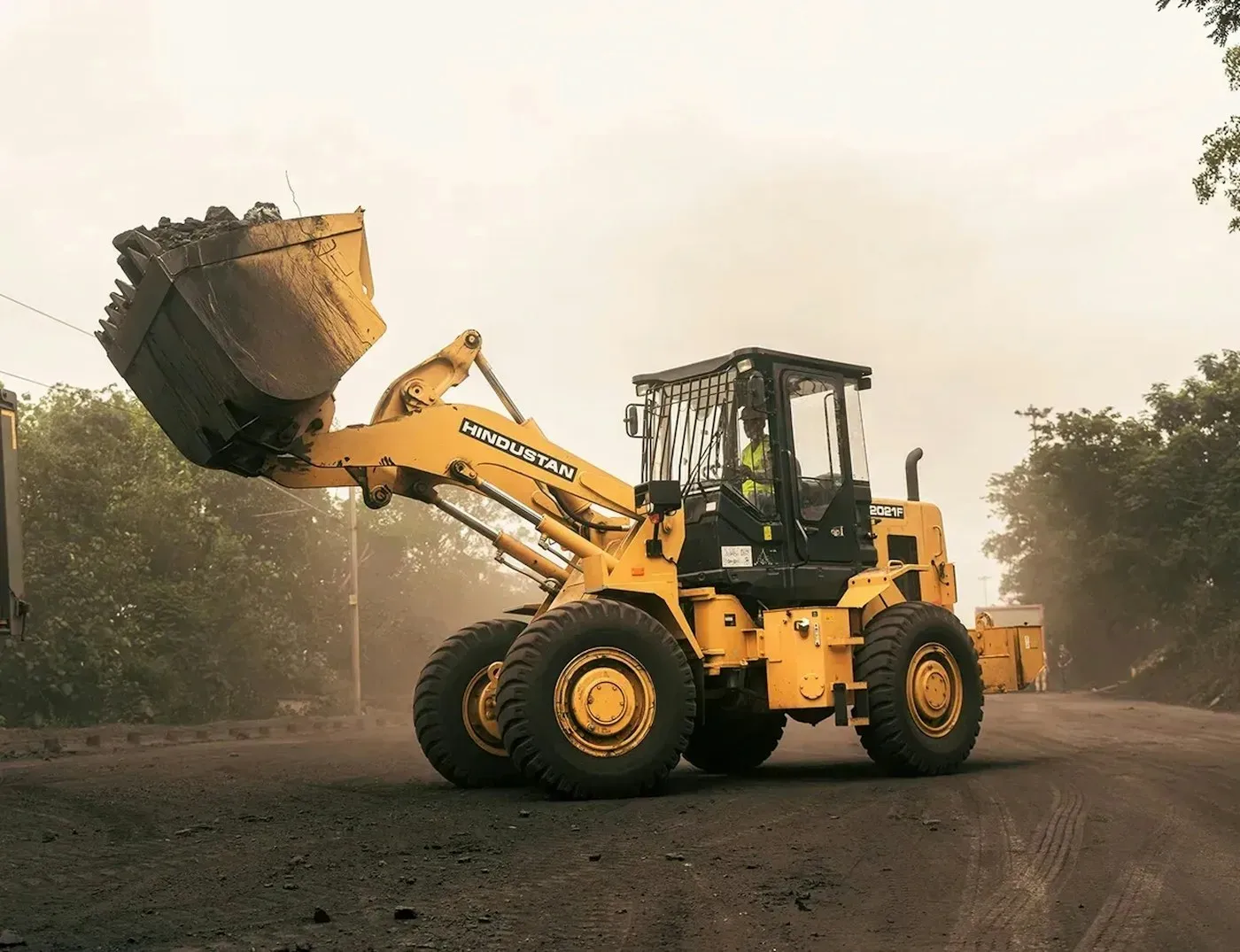 Wheel loader carrying earth in its bucket